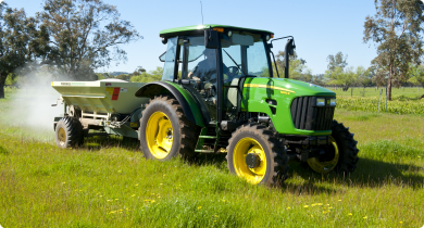 Tractor spreading fertiliser