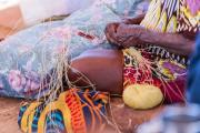 An Aboriginal women doing crafts