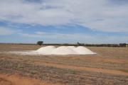 Agricultural lime dumped in a paddock ready to be spread. 