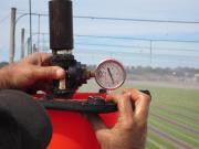Measuring sprinkler flow and pressure during an on farm irrigation assessment