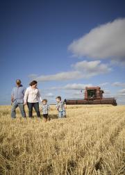 Farming family in field