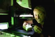 Pia Scanlan shows a mounted insect under the digital imaging microcsope