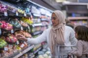 Muslim mother and daughter in a supermarket