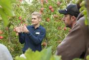 DAFWA development officer Rohan Prince discusses the merits of covering orchards with netting at a recent field day at Manjimup.