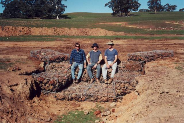 Photograph of gabion and Reno mattress drop structure protecting the eroded gully head