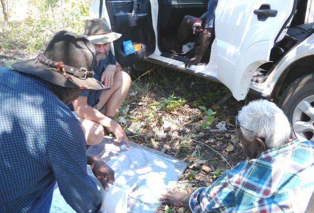 Photograph of male Garralyel (knowledgeable senior community members) helping DAFWA staff to plan the fieldwork program