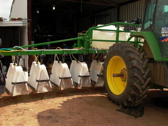 Shielded sprayers on a boom