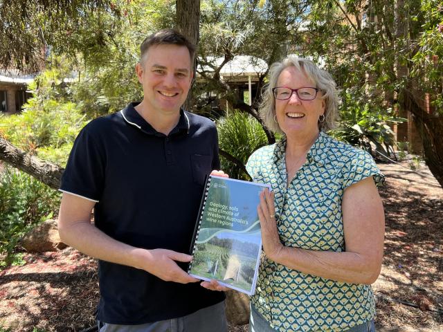 Department of Primary Industries and Regional Development’s soil scientist Angela Stuart-Street and GIS research scientist Peter Gardiner with a copy of the publication ‘Geology, soils and climate of Western Australia’s wine regions’.