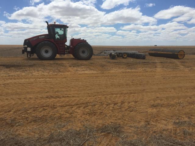 Track renovation system used by Spring Park farms to level the soil mound created between high traffic lanes overtime after soil renovation and fill the wheel tracks that caused uneven seeding depth the previous year. Tractor towing a set of offset discs and tyre roller