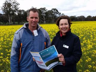 Canola variety guide Craig & Jackie Broomehill grower Craig Bignell with the Department of Agriculture and Food canola development officer Jackie Bucat and the newly released 2017 Canola variety guide for Western Australia.