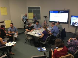 people talking in a workshop setting