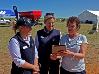 DAFWA senior research officer Sally Pelzer (right) shows Kylee Nelson (left) and Amy Fuchsbichler from the CBH Group the free MyCrop apps at the recent Mingenew-Irwin Group field day.