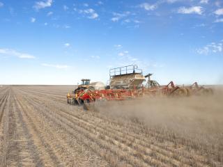 Seeding rig in dusty paddock. Seeding rig in dusty paddockl