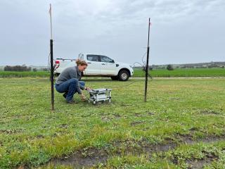 Technical Officer Danae Warden (DPIRD) installing a remotely monitored pitfall trap in pasture at Brookton in May 2024 Technical Officer Danae Warden (DPIRD) installing a remotely monitored pitfall trap in pasture at Brookton in May 2024