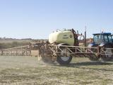 Boom sprayers are pulled by a tractor to spray large areas of land 