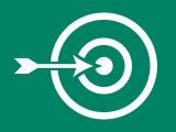 A target with an arrow in the bulls eye.