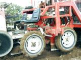 Two 15cm wide rotary hoes contained within metal housings under a vegatable planter