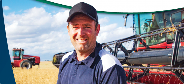 Cover of the 2023 WA Crop Sowing Guide showing Peter Cowan in his canola crop before harvest at Mt Walker