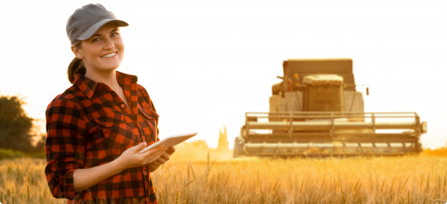 Female grain farmer with smart device