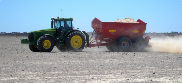 Photograph of tractor spreading gypsum on a sodic soil 