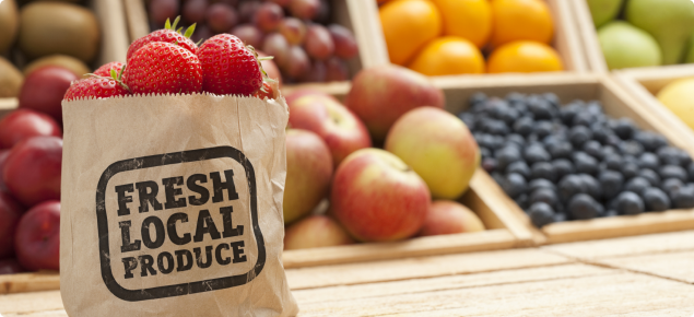 Fresh local produce label on a bag of fresh strawberries