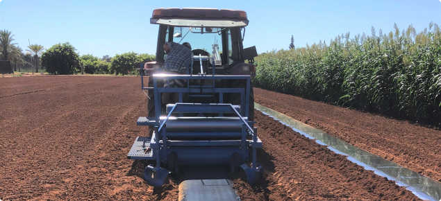 Tractor preparing trial site