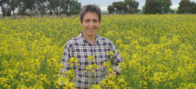 Imma Farre standing in a canola crop