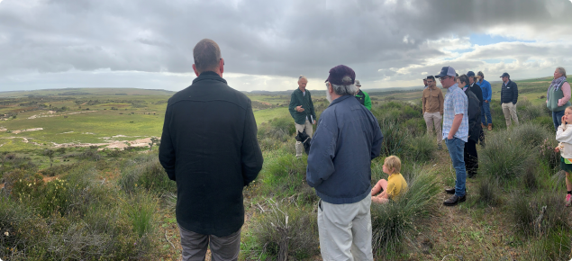 People looking out over a rural landscape