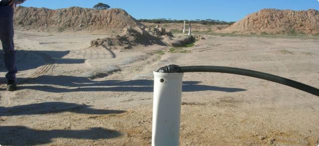Photograph of bore with siphon at Wallatin Creek, Western Australia