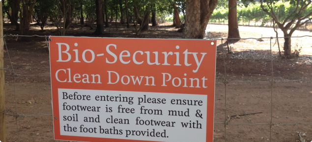 on-farm biosecurity signage at an orchard entrance