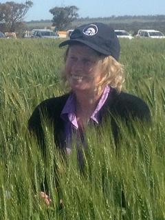 DAFWA research officer Dominie Wright crouched in a crop