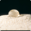 Water droplet on a bed of sand.