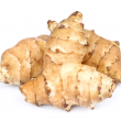 Light brown irregular shaped tubers of Jerusalem artichokes