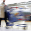 shopping trolley being pushed by consumer