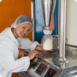Food technologist working on food manufacturing equipment